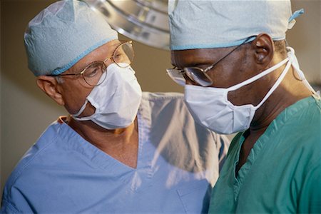 doctor with cap and mask - Surgeons in Operating Room Stock Photo - Rights-Managed, Code: 700-00328370