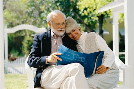 drawing of man looking at reflection - Couple Looking at Blueprints Stock Photo - Rights-Managed, Code: 700-00345619