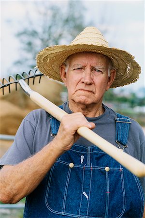 Farmer Carrying Pitch Fork Stock Photo - Rights-Managed, Code: 700-00345624