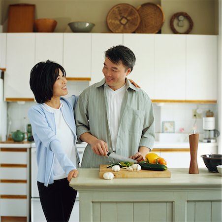 dangerous kitchen - Couple Preparing Food Stock Photo - Rights-Managed, Code: 700-00341215