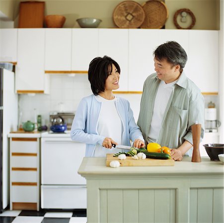 dangerous kitchen - Couple Preparing Food in Kitchen Stock Photo - Rights-Managed, Code: 700-00341213