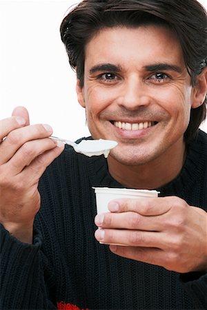 Man Eating Yogurt Stock Photo - Rights-Managed, Code: 700-00342384