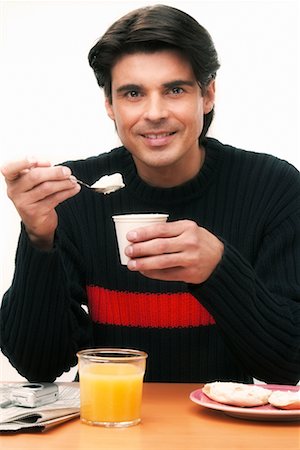 people eating bagels - Man Eating Breakfast Stock Photo - Rights-Managed, Code: 700-00342394