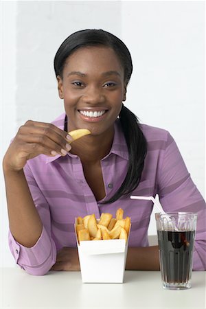 french fry smile - Woman Eating French Fries Stock Photo - Rights-Managed, Code: 700-00342874