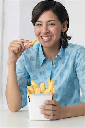 french fry smile - Woman Eating French Fries Stock Photo - Rights-Managed, Code: 700-00342887