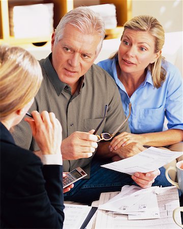 financial advisor talking to couple - Couple with Financial Advisor Stock Photo - Rights-Managed, Code: 700-00343327