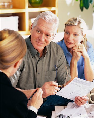 financial advisor talking to couple - Couple with Financial Advisor Stock Photo - Rights-Managed, Code: 700-00343329