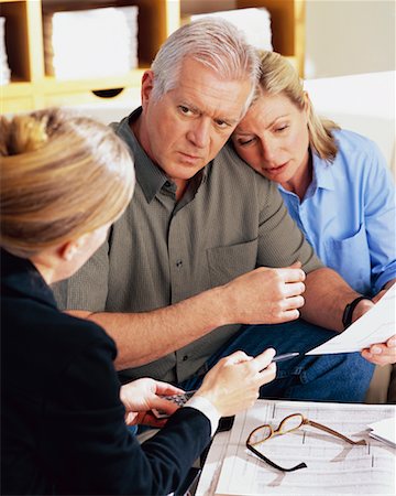 financial advisor talking to couple - Financial Advisor with Couple Stock Photo - Rights-Managed, Code: 700-00343331