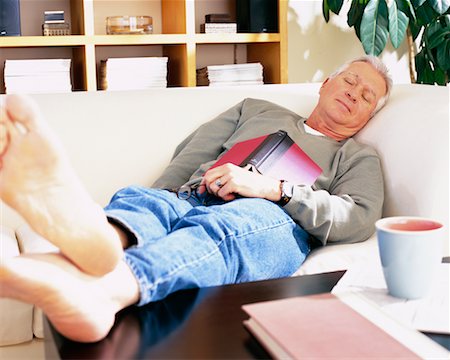 feet sofa comfort - Man Napping on Sofa Stock Photo - Rights-Managed, Code: 700-00343365