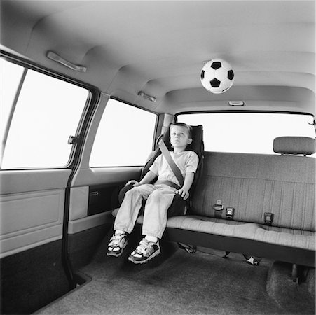 Boy Sitting in Car Foto de stock - Con derechos protegidos, Código: 700-00343606