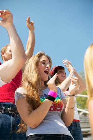 sport applauding - Teenage Spectators Sitting in Stands Stock Photo - Rights-Managed, Code: 700-00356765