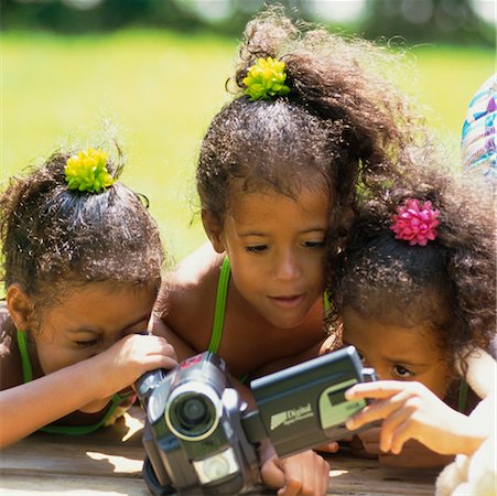 Three Girls Looking at Video Camera Stock Photo - Rights-Managed, Code: 700-00356924