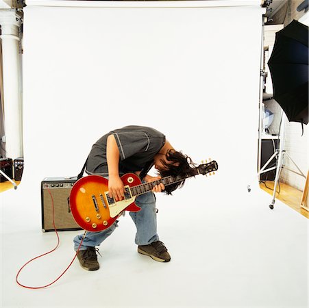 photo shoot for star - Child Playing Electric Guitar Stock Photo - Rights-Managed, Code: 700-00357146