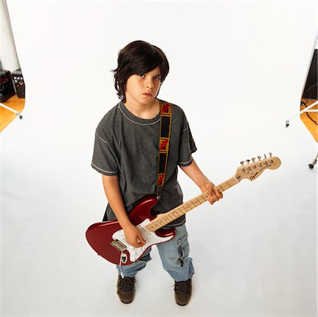 photo shoot for star - Child Playing Electric Guitar Stock Photo - Rights-Managed, Code: 700-00357148