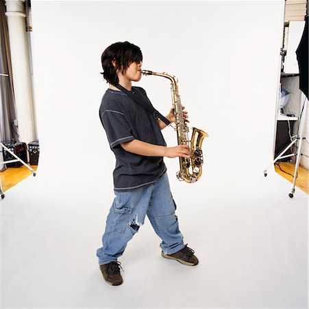 photo shoot for star - Child Playing Saxophone Stock Photo - Rights-Managed, Code: 700-00357142