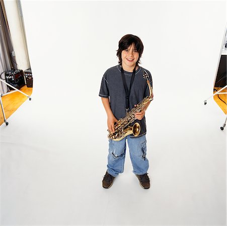 photo shoot for star - Child Holding Saxophone Stock Photo - Rights-Managed, Code: 700-00357143