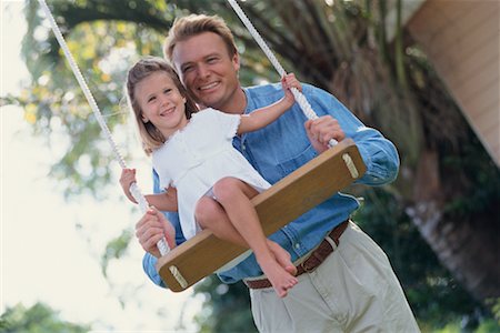 pushing kids on a swing - Father Pushing Daughter on Tree Swing Stock Photo - Rights-Managed, Code: 700-00357414