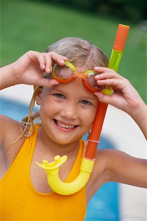Portrait of Girl Wearing Bathing Suit, Goggles, and Snorkel Stock Photo - Rights-Managed, Code: 700-00357421