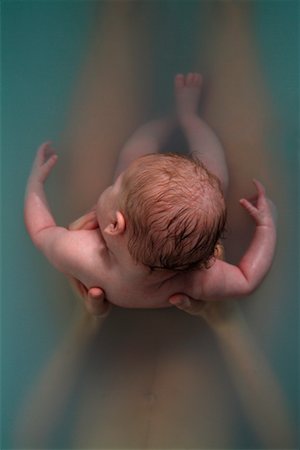 simsearch:700-00363780,k - Woman Holding Baby in Bathtub Fotografie stock - Rights-Managed, Codice: 700-00357532