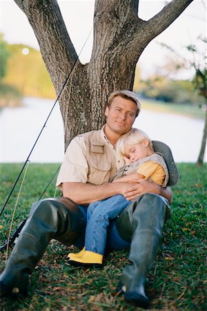 portrait of young boy fishing - Father and Son Sitting on Riverbank Stock Photo - Rights-Managed, Code: 700-00357740