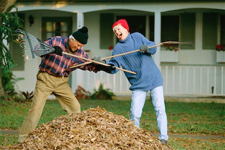 ridiculous husband senior couple - Couple Fighting with Rakes Stock Photo - Rights-Managed, Code: 700-00357741