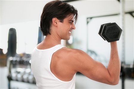 Man Lifting Weights in Gym Stock Photo - Rights-Managed, Code: 700-00350125