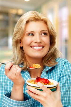 Woman Eating Cereal Stock Photo - Rights-Managed, Code: 700-00350144