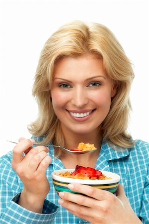 Woman Eating Bowl of Cereal Stock Photo - Rights-Managed, Code: 700-00350146