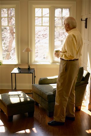 dan lim - Man Looking Out Window Fotografie stock - Rights-Managed, Codice: 700-00350638