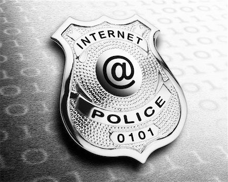 simsearch:700-00044032,k - Police Badge Displaying @ Symbol Stock Photo - Rights-Managed, Code: 700-00350676