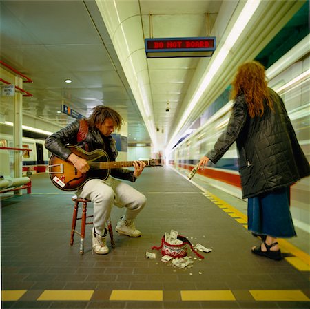 Woman Giving Busker Money Stock Photo - Rights-Managed, Code: 700-00350717