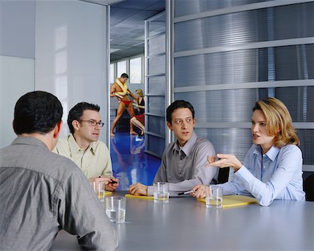 Business People in Meeting Stripper in Background Stock Photo - Rights-Managed, Code: 700-00350713