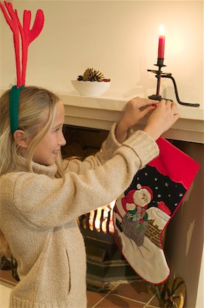 preteen nylon - Girl Hanging Stocking from Fireplace Stock Photo - Rights-Managed, Code: 700-00350856
