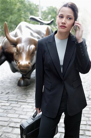 sculpture bull - Businesswoman on Cell Phone New York City, New York USA Stock Photo - Rights-Managed, Code: 700-00364038