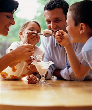 photo of family eating icecream - Family Sharing Sundae Stock Photo - Rights-Managed, Code: 700-00364210