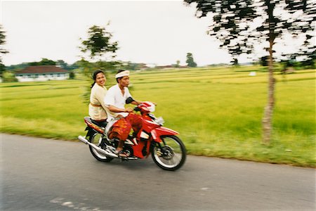 simsearch:862-06543131,k - Balinese Couple on Motorcycle Ubud Village, Bali, Indonesia Stock Photo - Rights-Managed, Code: 700-00364315