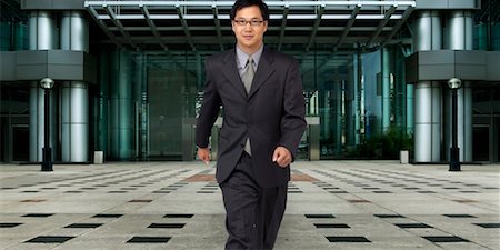 simsearch:700-00039942,k - Businessman Walking Outdoors Stock Photo - Rights-Managed, Code: 700-00364359