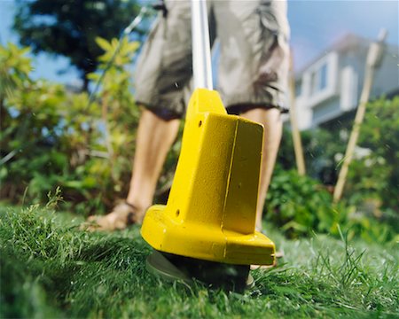 Man Using a Grass Trimmer Foto de stock - Direito Controlado, Número: 700-00366057