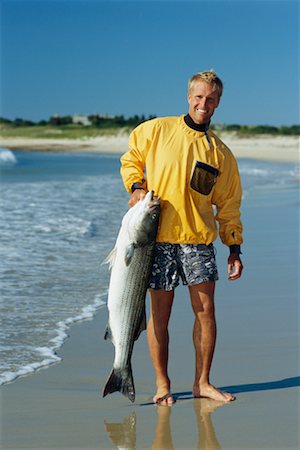 Man Holding Giant Fish Stock Photo - Rights-Managed, Code: 700-00366317