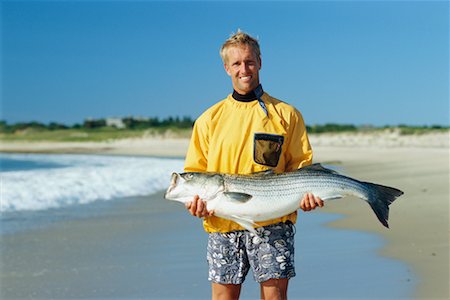 Man Holding Giant Fish Stock Photo - Rights-Managed, Code: 700-00366318
