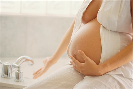 pregnant woman breast - Pregnant Woman Running a Bath Stock Photo - Rights-Managed, Code: 700-00368074