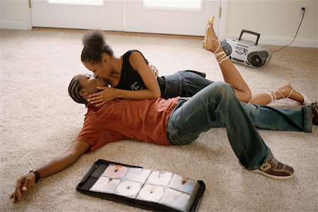 Couple Kissing and Listening To Music Stock Photo - Rights-Managed, Code: 700-00368088