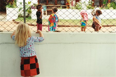 Girl Watching Children Play Stock Photo - Rights-Managed, Code: 700-00361279