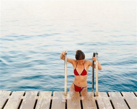 Woman Climbing Onto Dock Sinai, Egypt Stock Photo - Rights-Managed, Code: 700-00361283