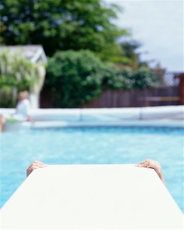 Child's Hands Hanging on Diving Board Stock Photo - Rights-Managed, Code: 700-00361684