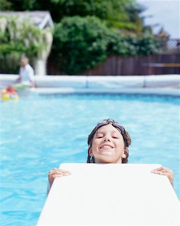 Girl Hanging on Diving Board Stock Photo - Rights-Managed, Code: 700-00361683