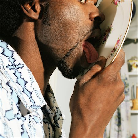 Man Licking Plate Stock Photo - Rights-Managed, Code: 700-00361927