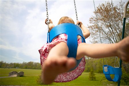 simsearch:700-01236750,k - Girl on Swing Fotografie stock - Rights-Managed, Codice: 700-00363415