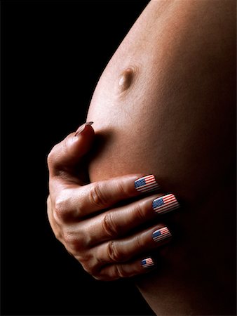 Close Up of Hand on Pregnant Stomach Stock Photo - Rights-Managed, Code: 700-00363789