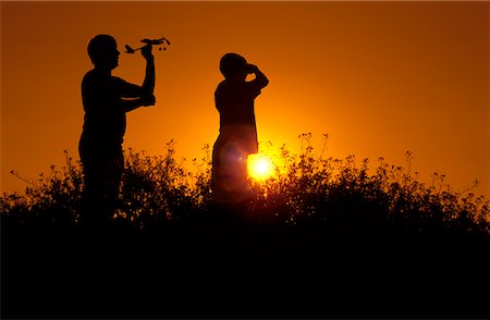 silhouette father and son sunset - Father and Son with Toy Plane Stock Photo - Rights-Managed, Code: 700-00363934